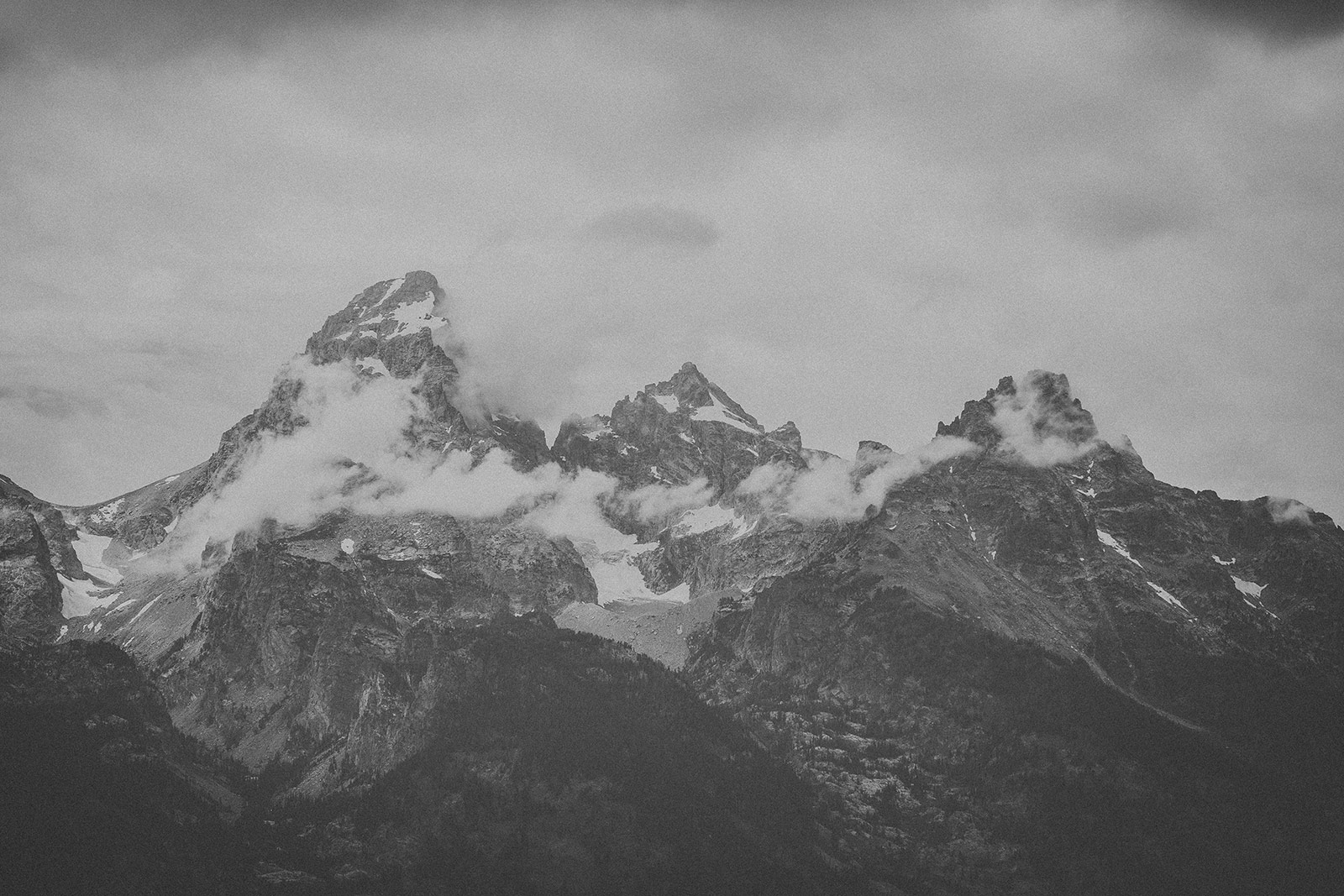 A black and white photo of some mountains